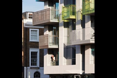 The vertical, rectangular proportions of Arundel Square’s new facade ape those of the existing terraces